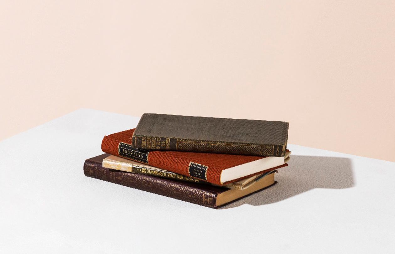 A pile of leather bound books