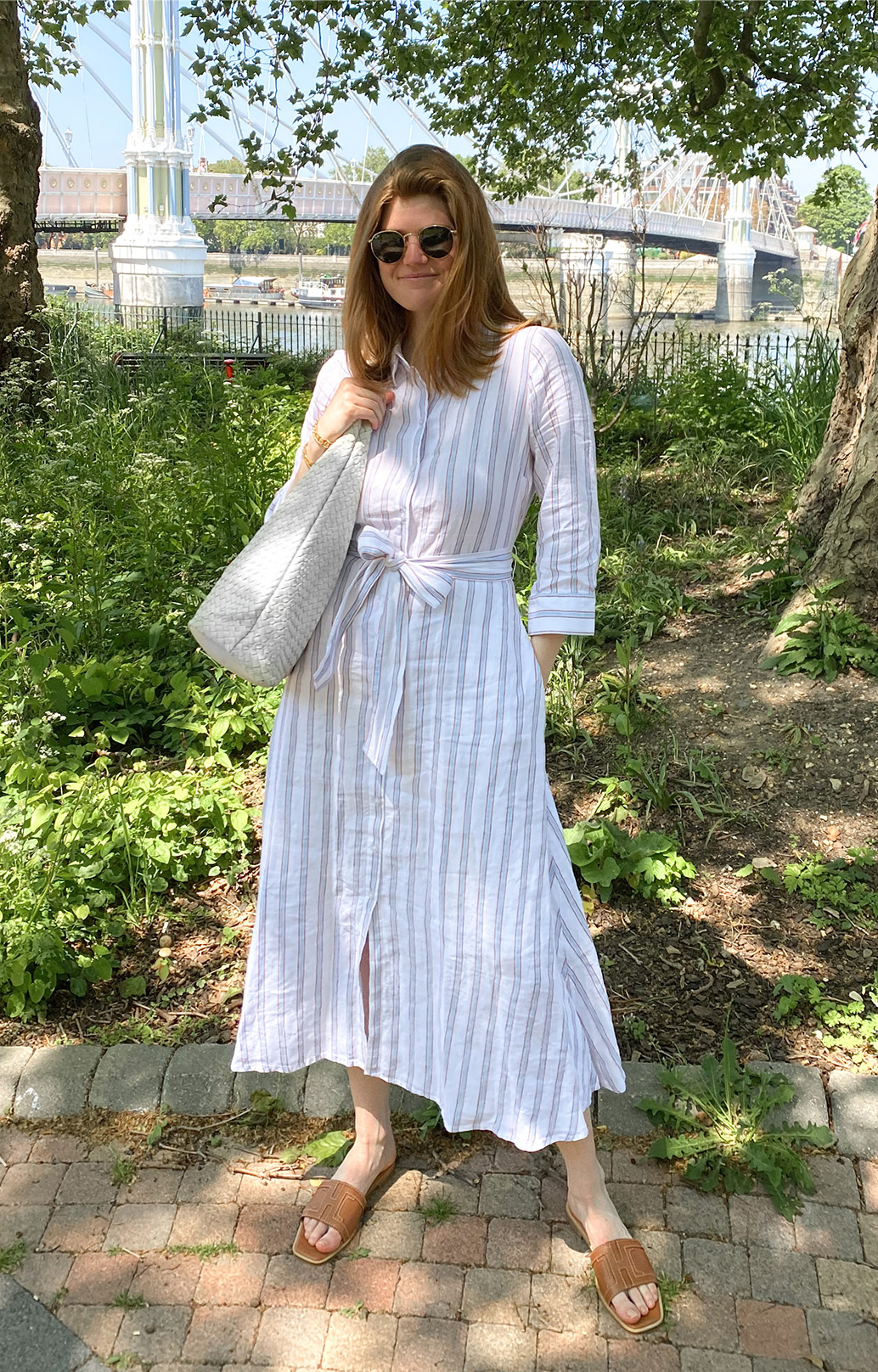 Content creator @molliemoore_ photographed at Battersea Park in London wearing Hobbs' Ciara linen dress.