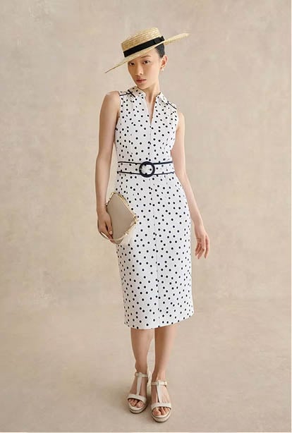 A woman wearing a Hobbs dress.