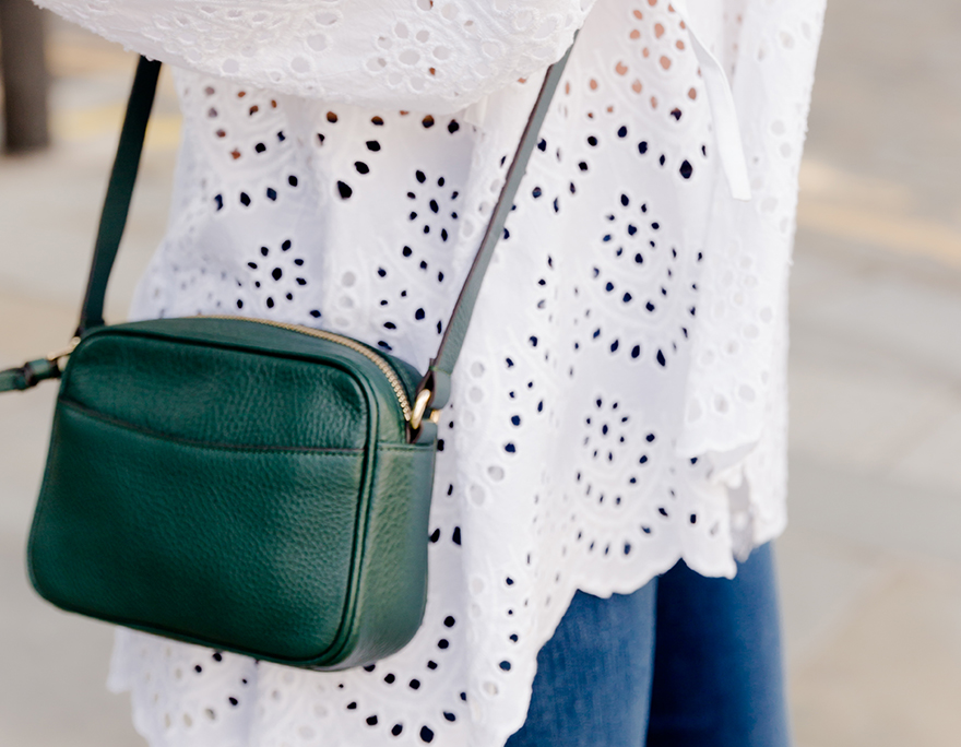 A snapshot image of an outfit featuring a white blouse and a green crossbody bag worn by Hobbs UK & International Visual Specialist, Selena Trkuljia.