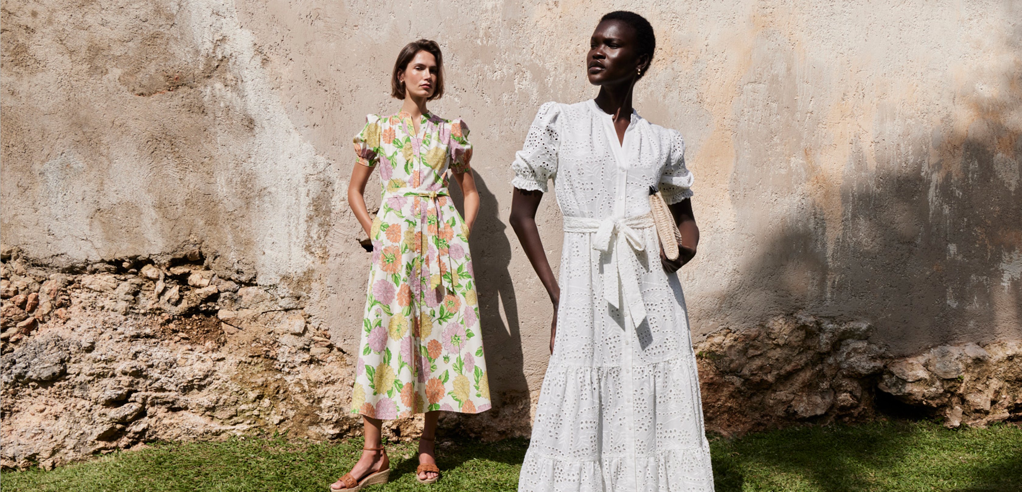 An image of two models wearing Hobbs’ summer dresses in an outside setting.