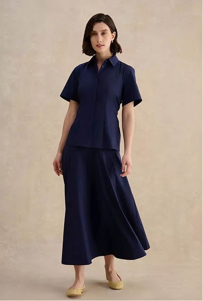 A woman wearing a Hobbs dress.