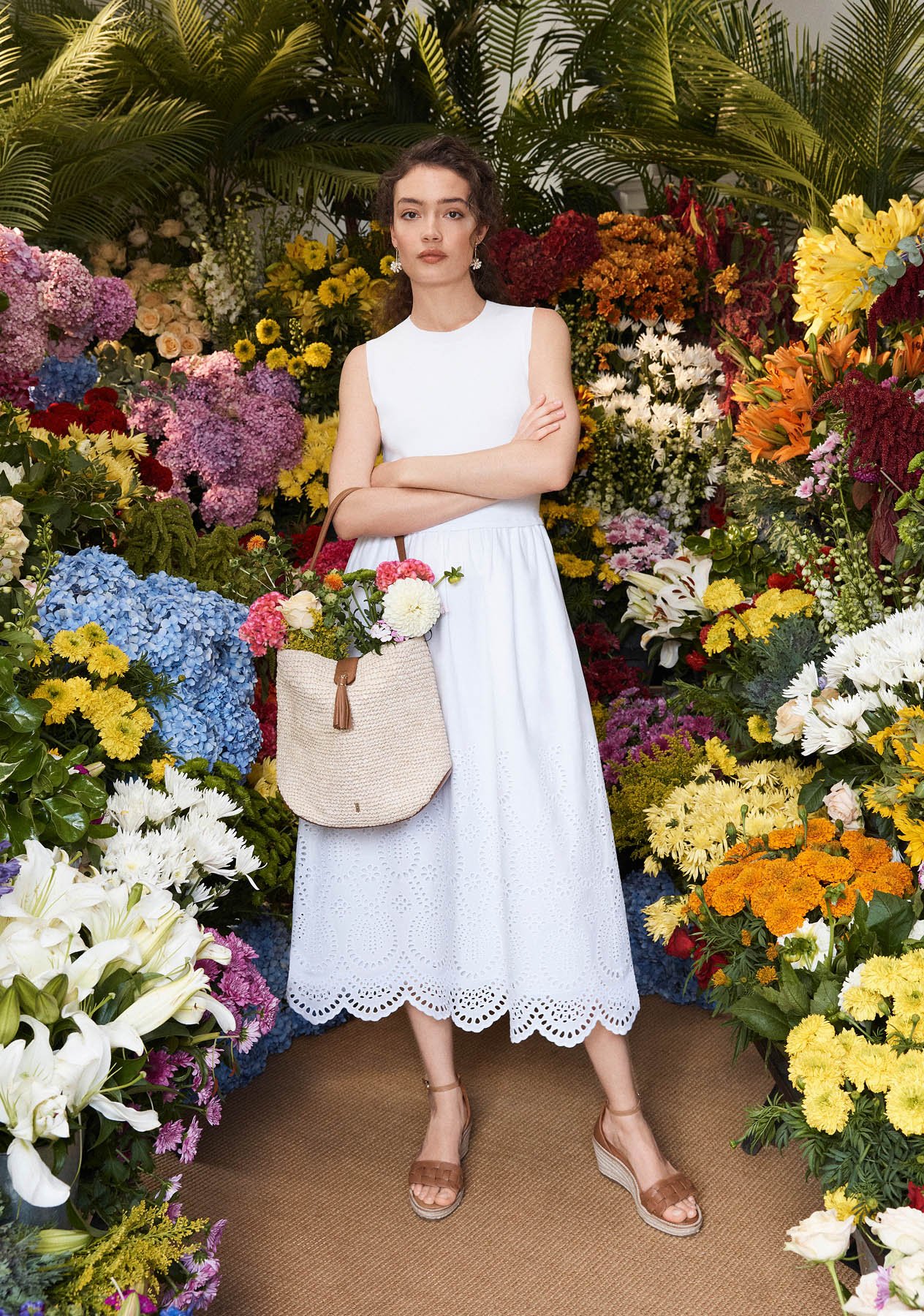 Model photographed in a white dress.