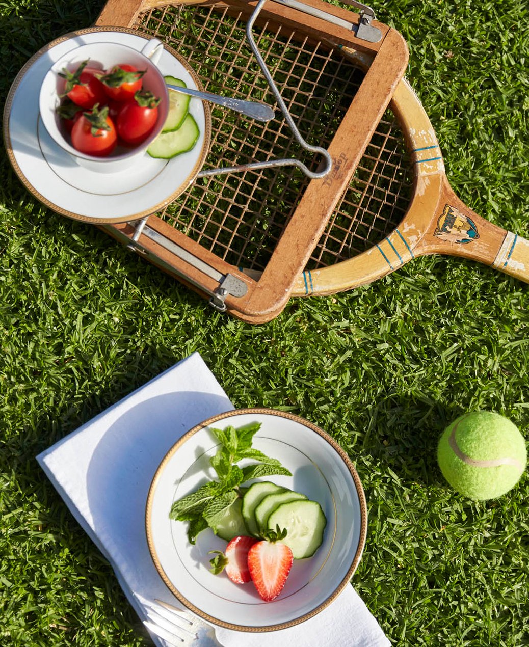 Flatlay with strawberries and tennis balls