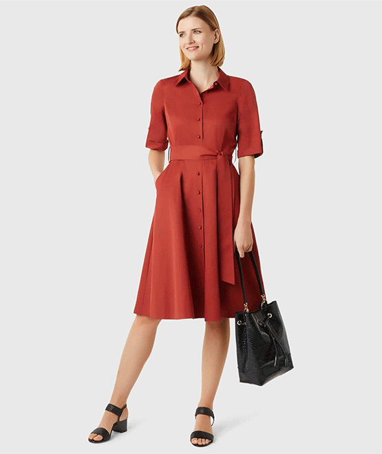 The right shows a mid-sleeved shirt dress in red with a waist-tie detail worn with heeled sandals in black and leather tote bag in black. Add a smart belt such as the one shown on the left which is a black leather belt with an embossed snake print and gold buckle to add some definition. All from Hobbs.