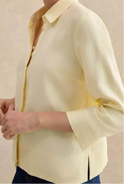 A woman wearing a Hobbs dress.