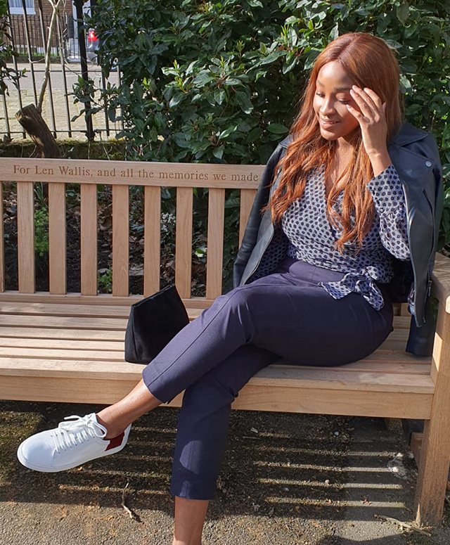 Fashion blogger @rufaro_styling photographed on a walk wearing Hobbs Tania navy leather jacket, Elizabeth Blouse and Yasmin capri trousers.