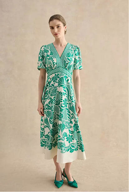 A woman wearing a Hobbs dress.