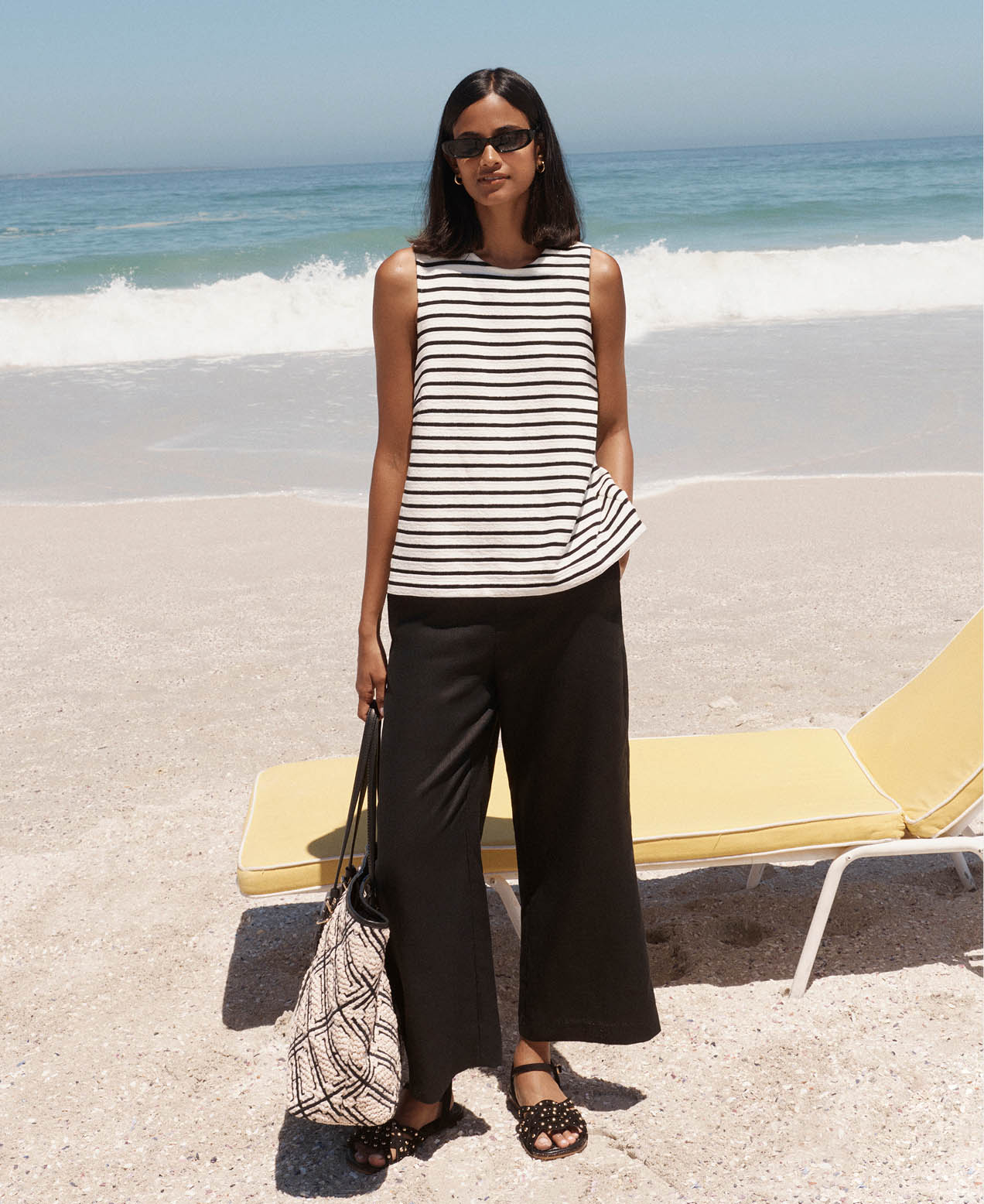 A woman wearing Hobbs linen trousers.