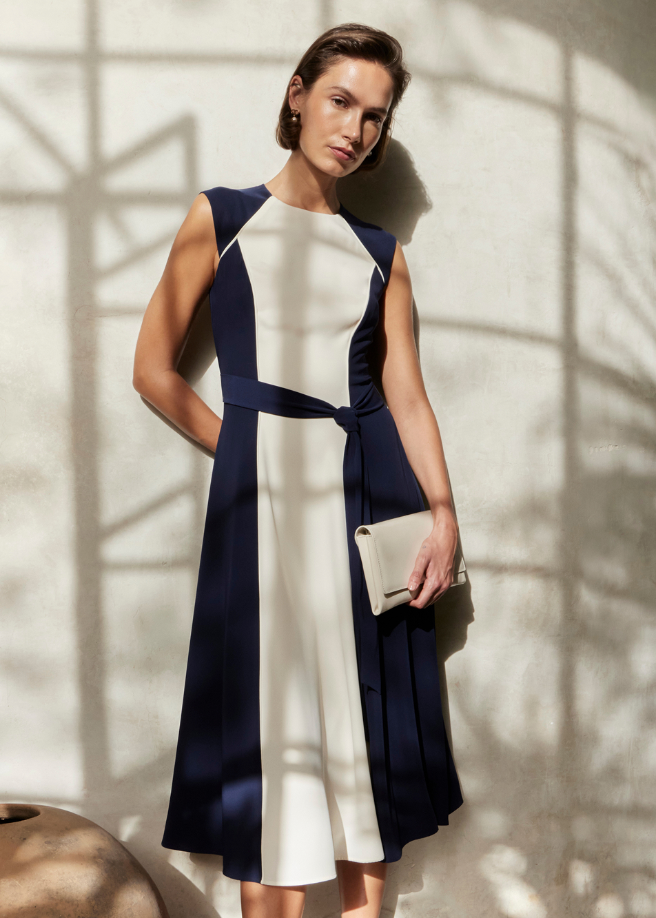 An image of a model wearing a Hobbs colour block occasion dress.