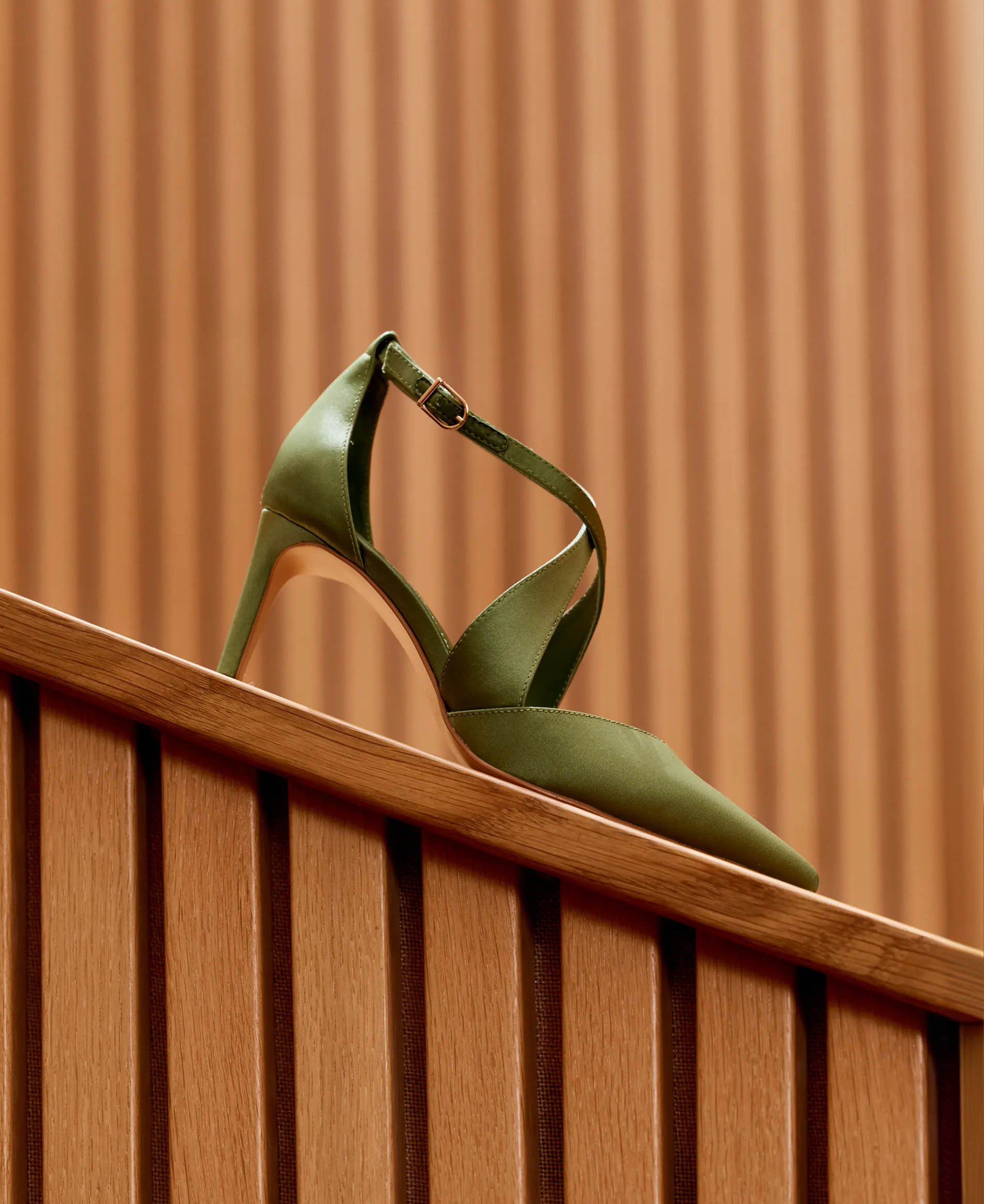 An image of a green satin shoe.