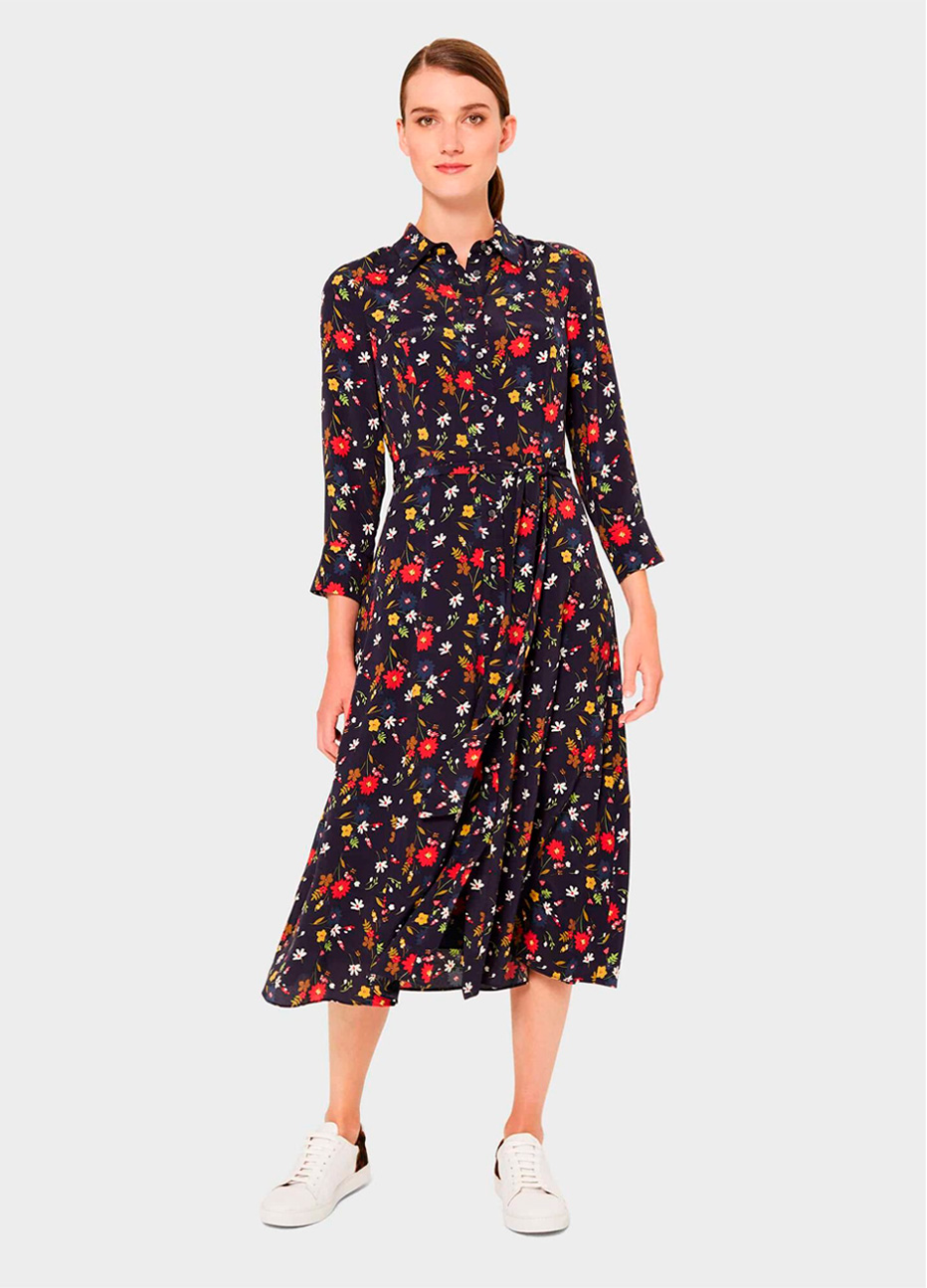 Long sleeve shirt dress with a floral pattern paired with white leather trainers by Hobbs.