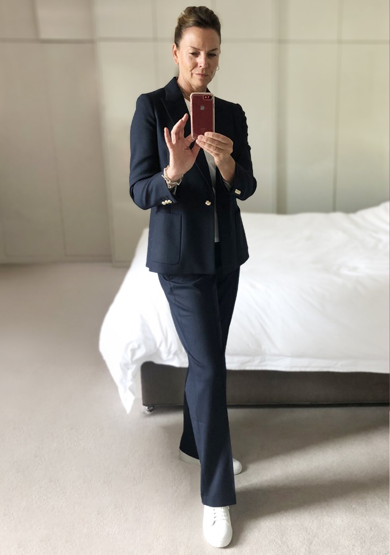 Hobbs Product Director, shows us how to make the most of your wardrobe using versatile staples from your workwear wardrobe. Here, in a classic navy blue Hobbs trouser suit.