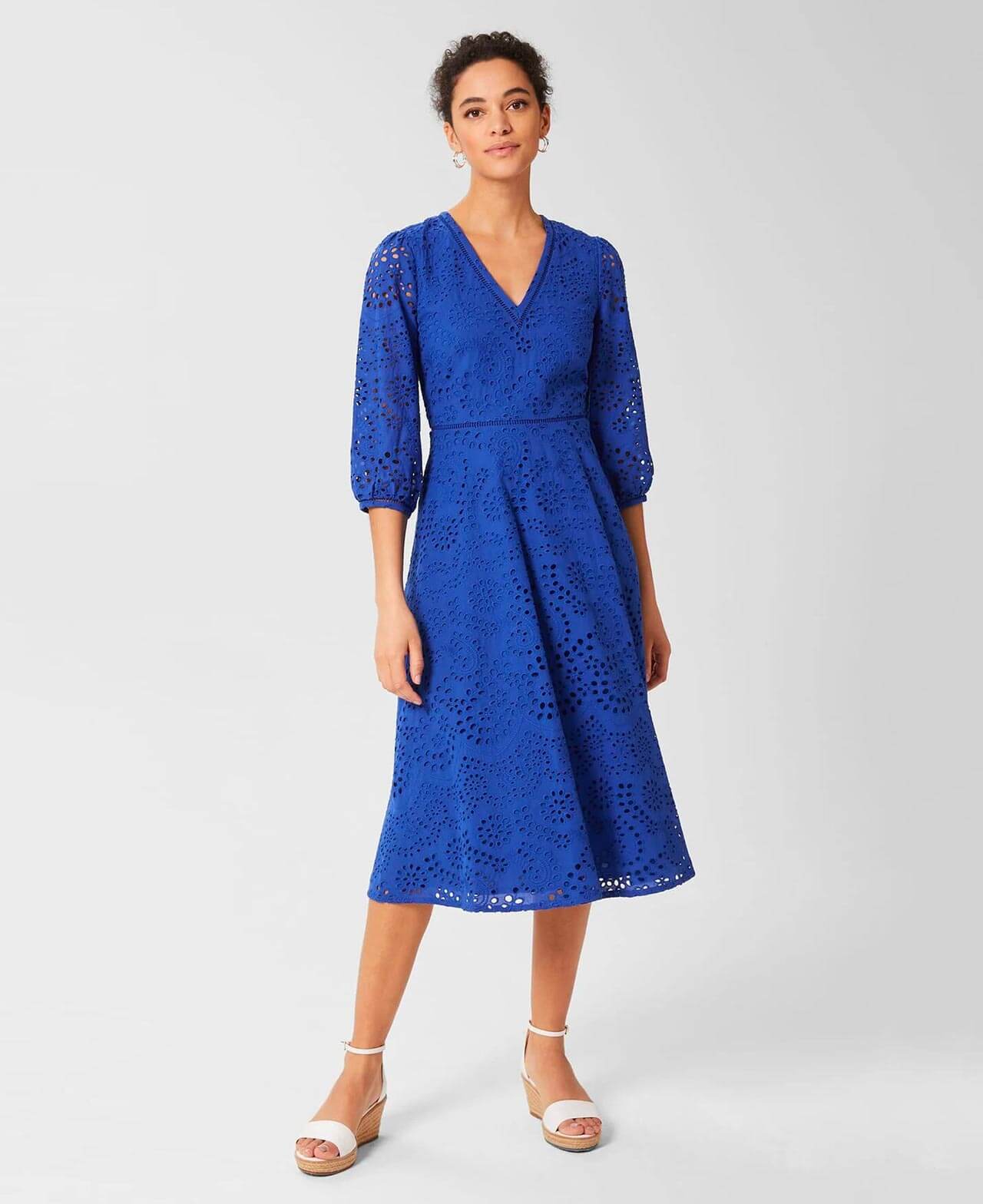 Hobbs model wears a blue broderie dress with white espadrille wedge sandals.