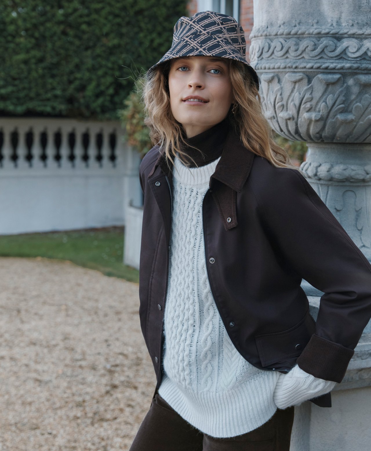 A woman wearing Hobbs coats and jackets.