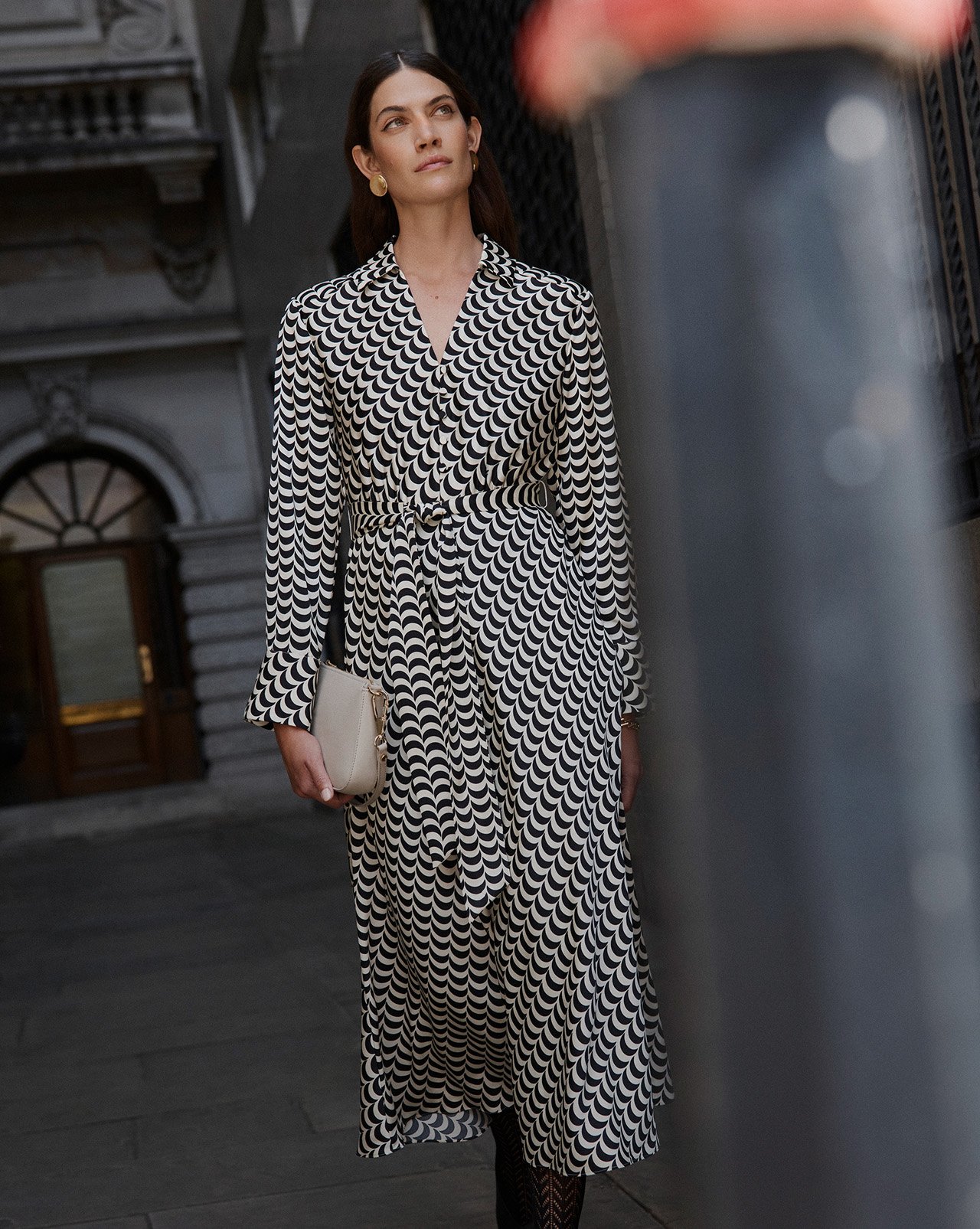 A woman wearing a Hobbs trench coat.