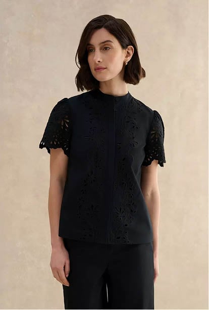 A woman wearing a Hobbs dress.