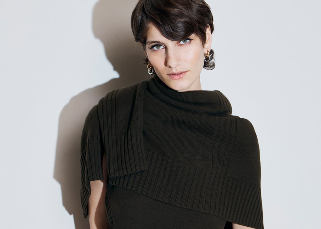 Model photographed with a cardigan.