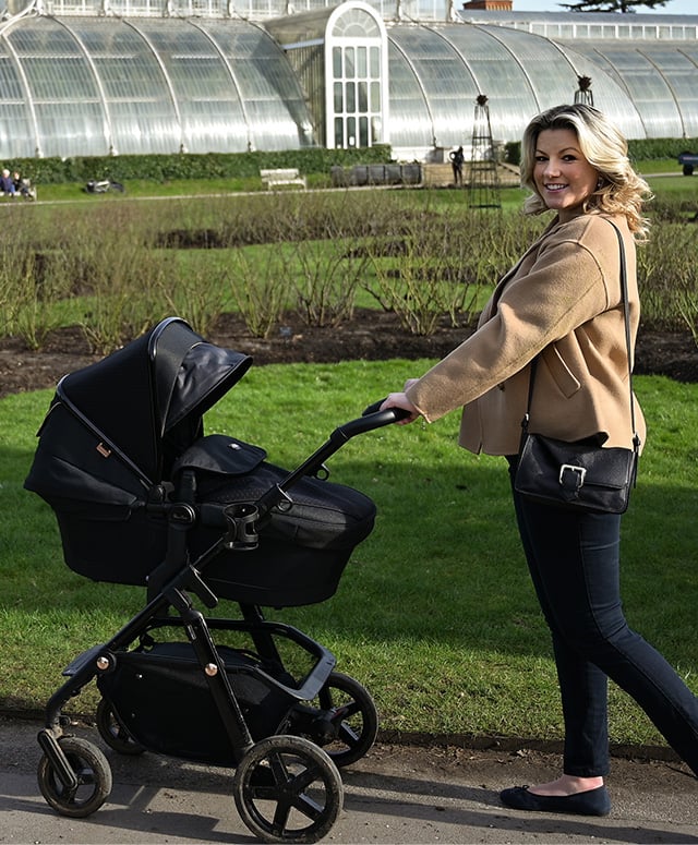 Singer Natalie Rushdie photographed on a walk wearing Hobbs Rosanna camel jacket, Daniella jumper and Gia black jeans.