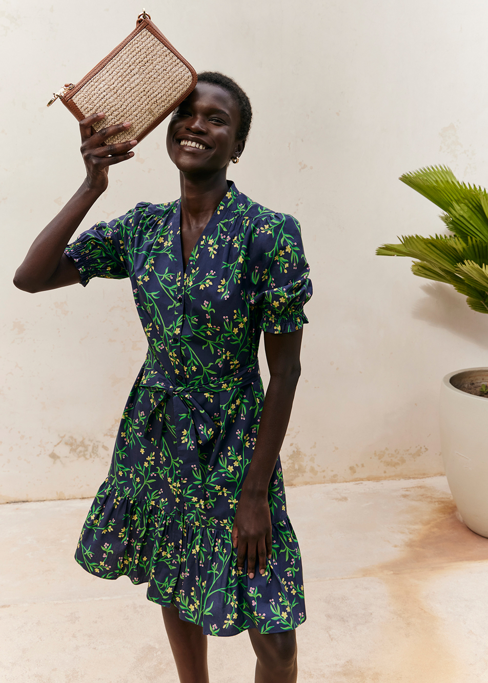 An image of a model wearing a Hobbs’ tiered floral dress.