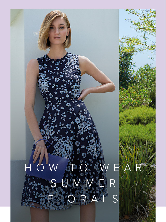 Floral occasion dress in dark blue with matching clutch by Hobbs.