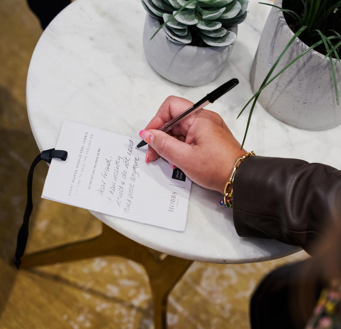 Customer photographed writing a personalised note