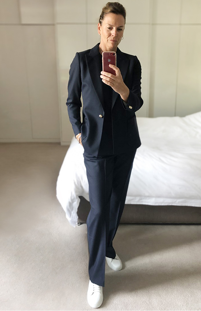 Hobbs Product Director, Sally Ambrose shows us how to style classic pieces whethe working or relaxing. Here, wearing the tailored navy blue Martina blazer with a t-shirt and straight-leg trousers.