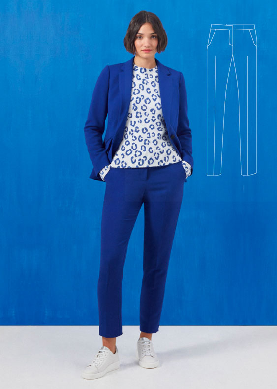 Model wears Hobbs tailored Abigail navy tailored jacket with matching tapered trousers.