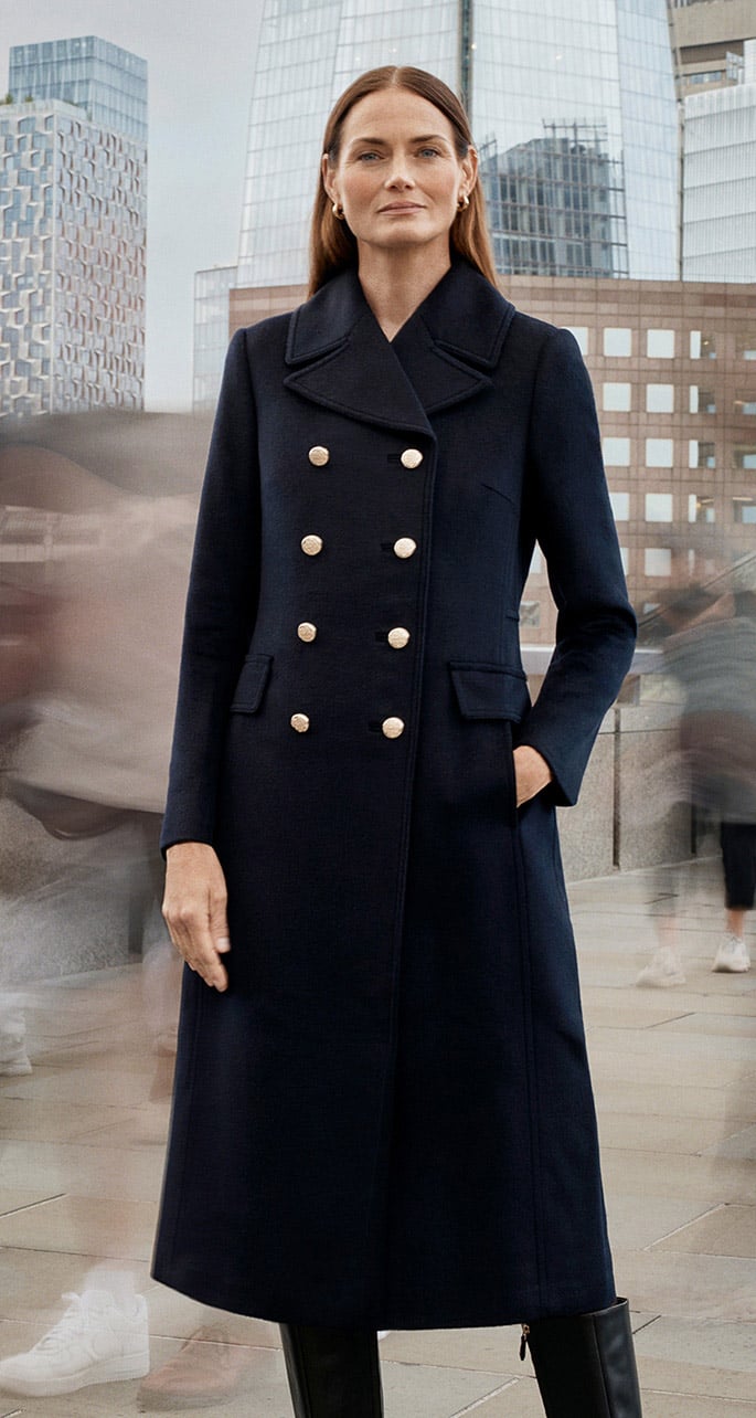 A woman wearing a Hobbs wool coat.