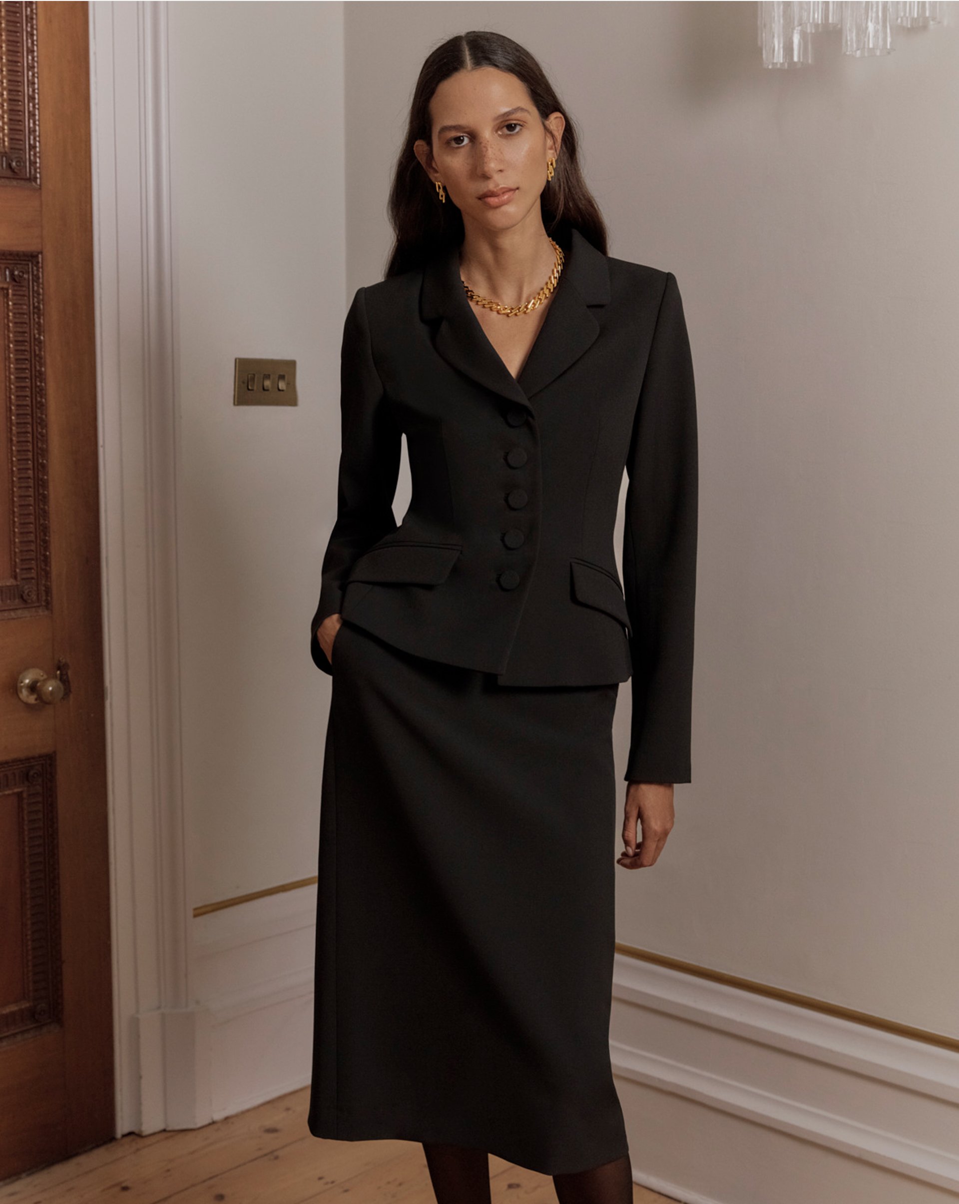 A woman wearing a Hobbs trench coat.