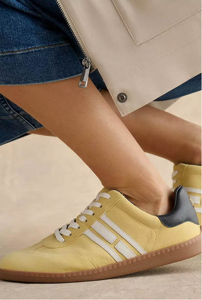 A woman wearing a Hobbs dress.