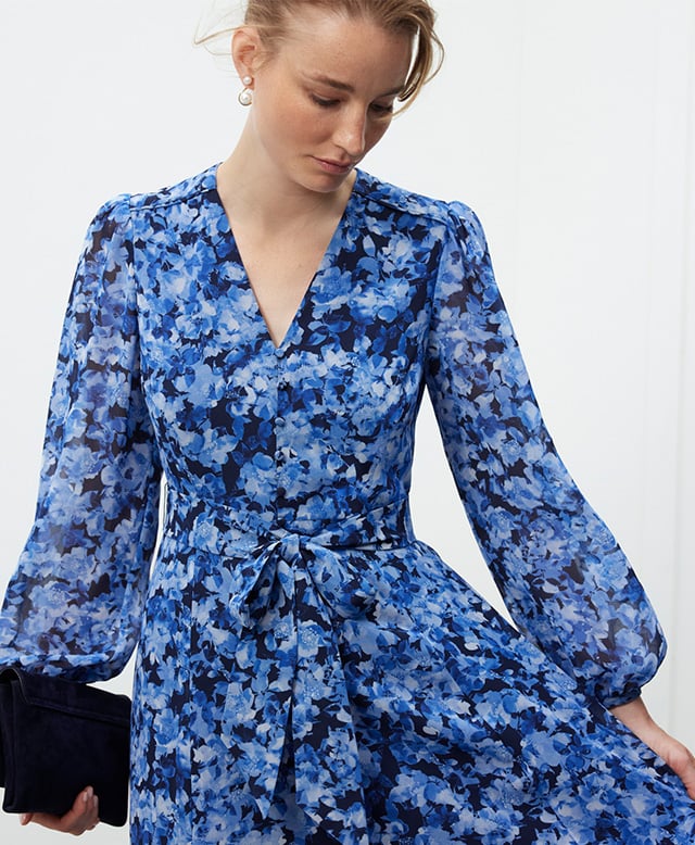 A woman wearing a Hobbs floral print occasion dress