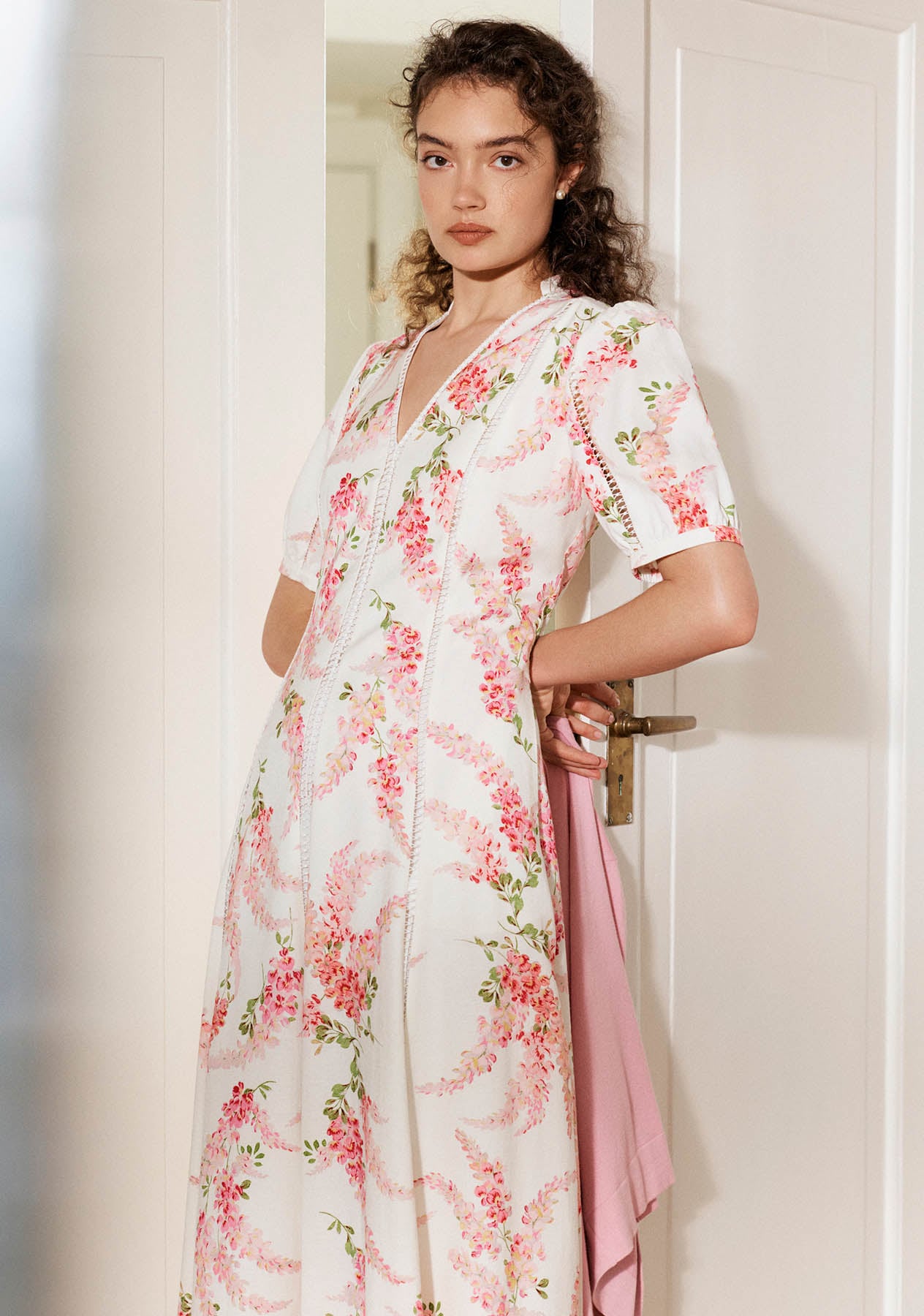 A woman wearing a Hobbs linen occasion dress.