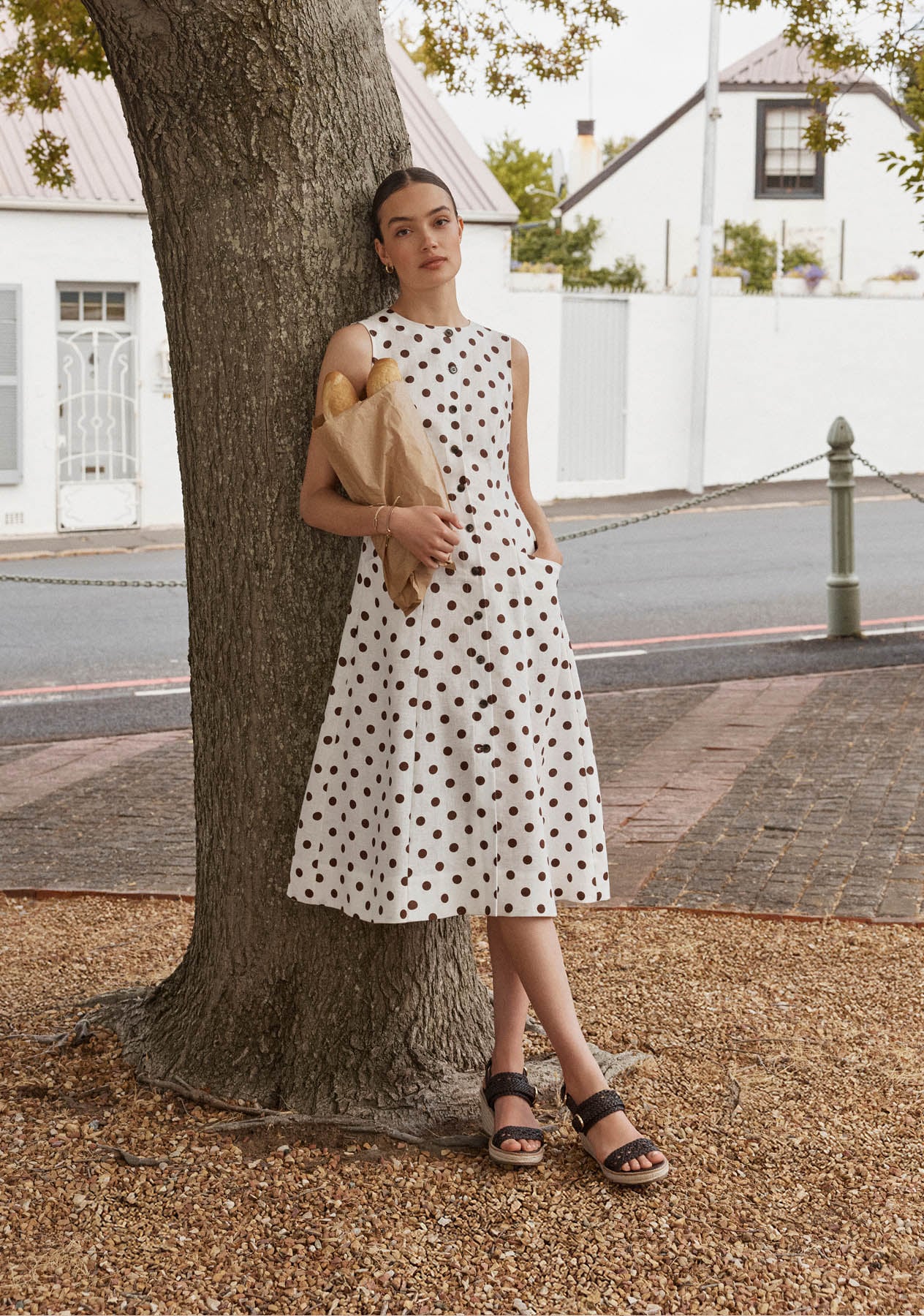 A woman wearing a Hobbs polka dot dress