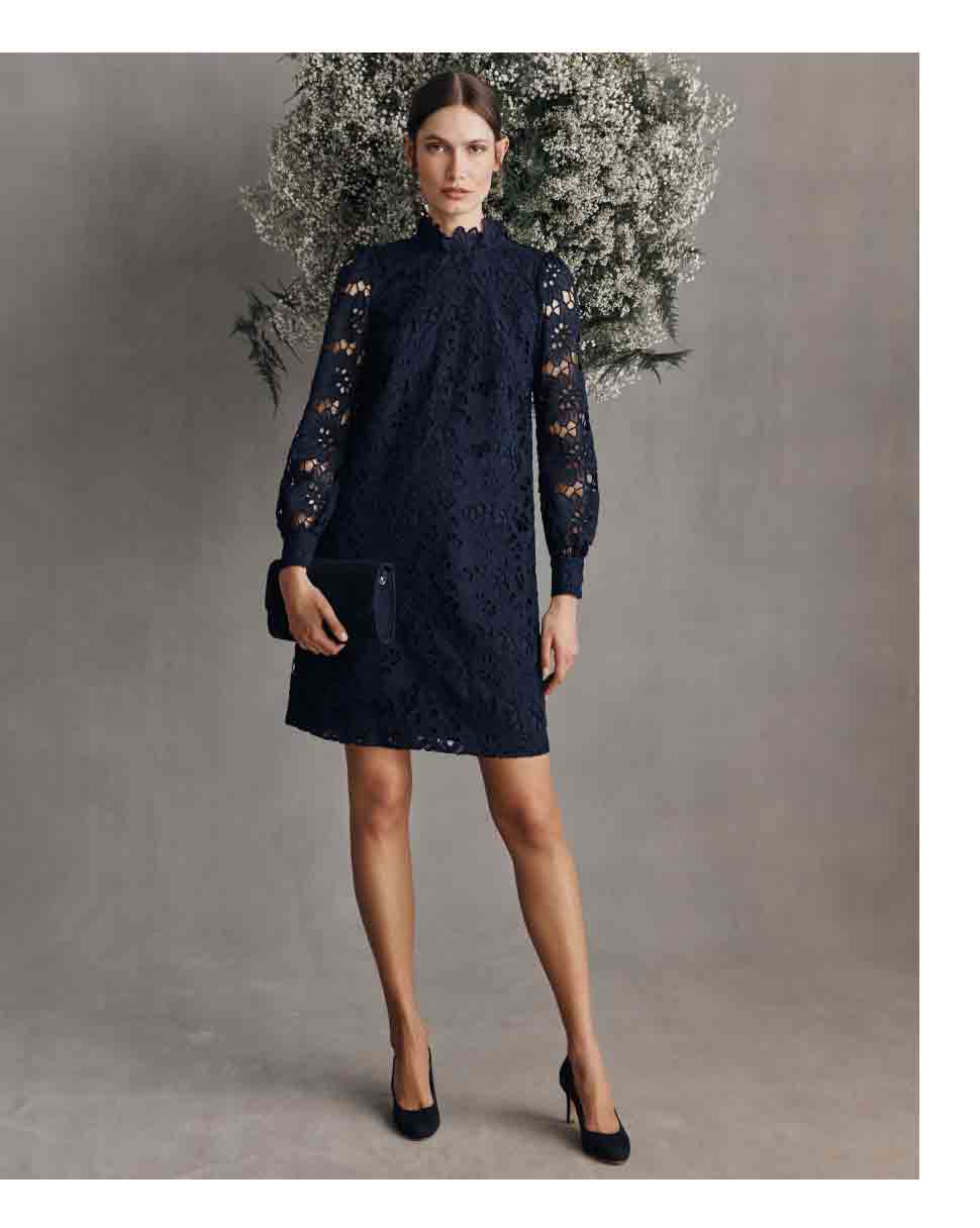 Hobbs model wears a navy lace mini dress