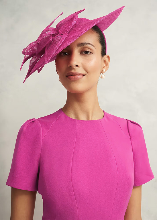 A gallery of four images of models wearing Hobbs fascinators.