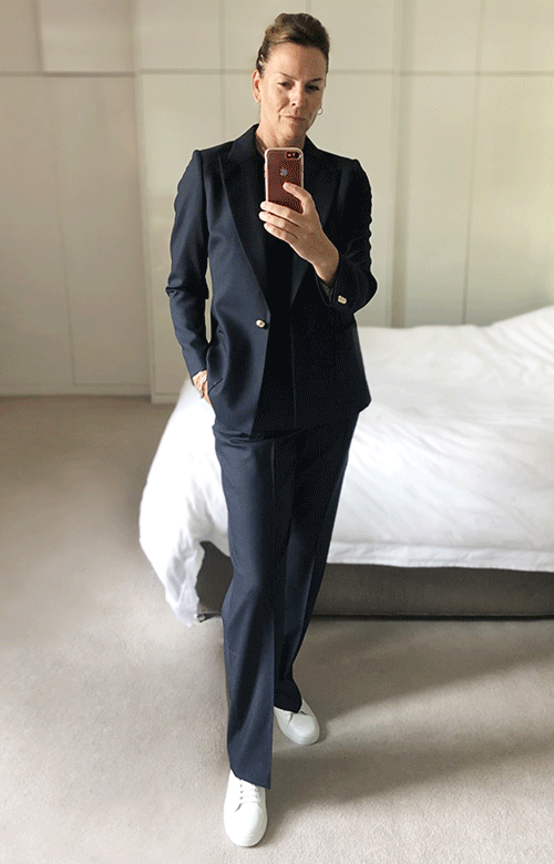 Hobbs Product Director, Sally Ambrose shows us how to style classic pieces whethe working or relaxing. Here, wearing the tailored navy blue Martina blazer with a t-shirt and straight-leg trousers.