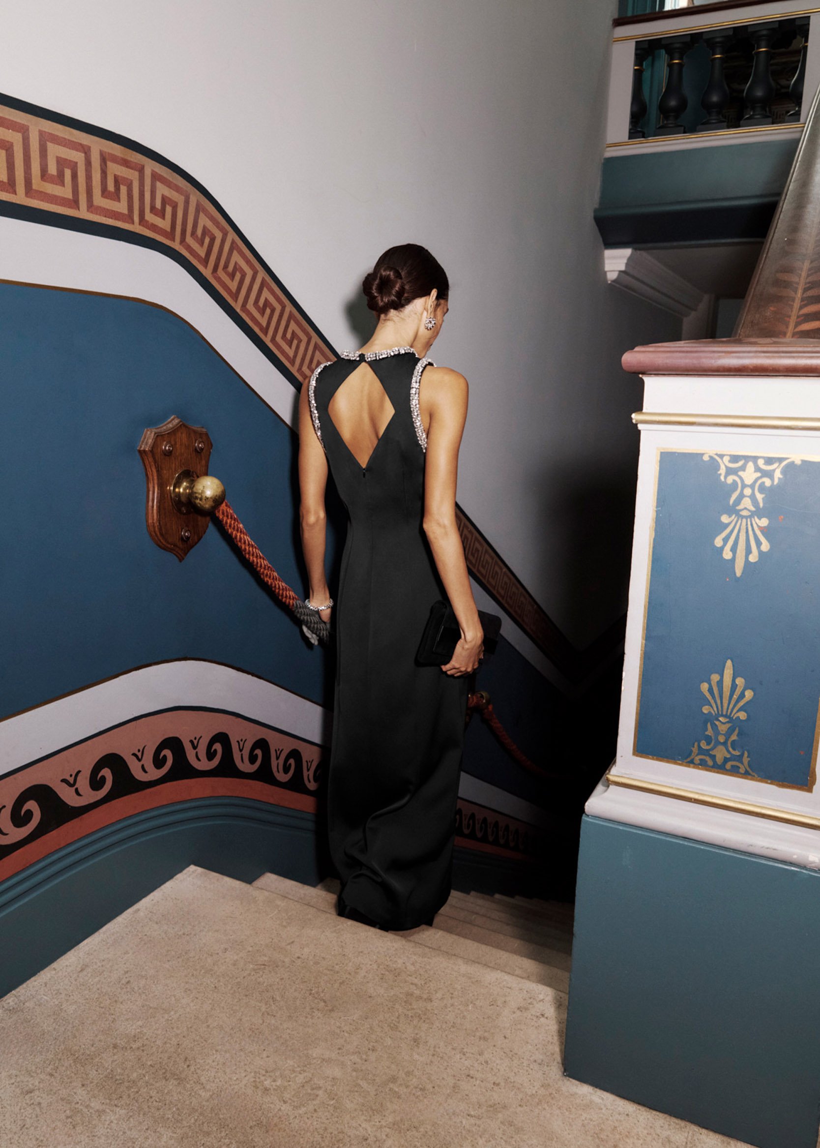 A woman wearing Hobbs’ black occasion gowns.