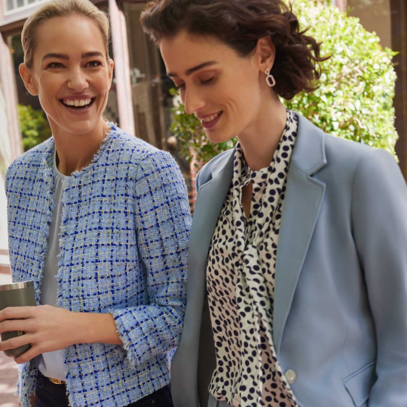 Image of two models leaving a cafe together wearing Hobbs outfits