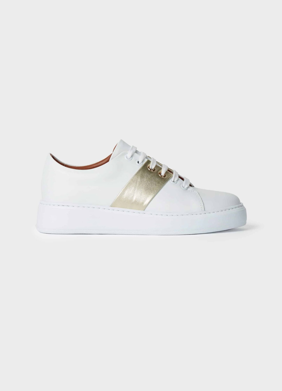 Hobbs leather trainer in white with a white sole and a gold metallic strip in the middle.